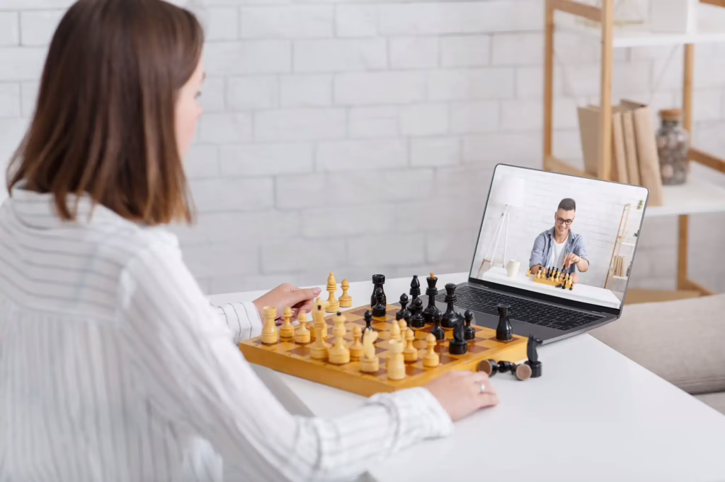 online chess at home woman and guy play on board